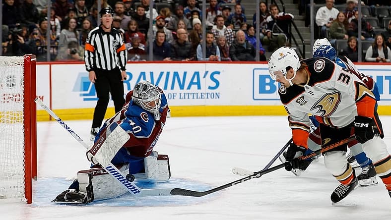 Dec 5, 2023; Denver, Colorado, USA; Colorado Avalanche goaltender Alexandar Georgiev (40) makes a save against Anaheim Ducks center Sam Carrick (39) in the first period at Ball Arena. Mandatory Credit: Isaiah J. Downing-USA TODAY Sports