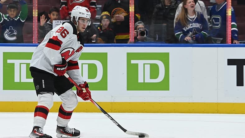 Dec 5, 2023; Vancouver, British Columbia, CAN; New Jersey Devils center Jack Hughes (86) controls the puck during the pregame warmup against the Vancouver Canucks at Rogers Arena. Mandatory Credit: Simon Fearn-USA TODAY Sports