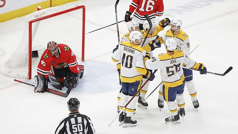 Dec 5, 2023; Chicago, Illinois, USA; Nashville Predators center Ryan O'Reilly (90) celebrates with teammates after scoring against the Chicago Blackhawks during the second period at United Center. Mandatory Credit: Kamil Krzaczynski-USA TODAY Sports