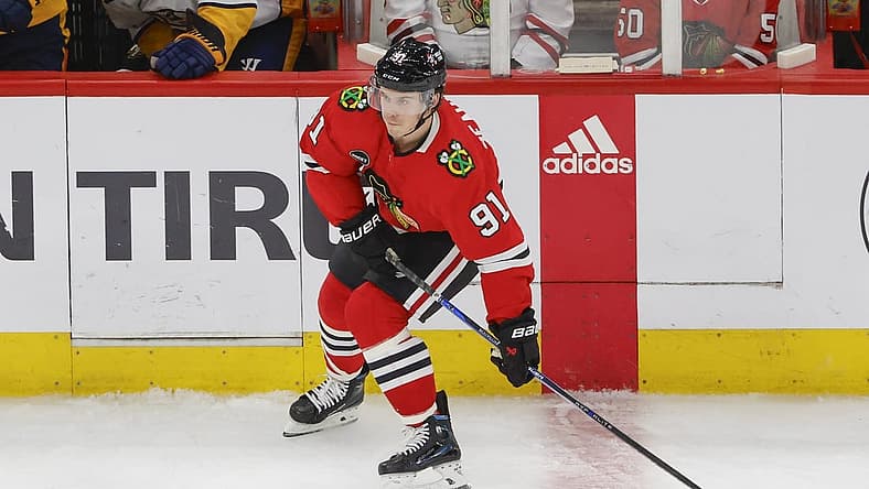 Dec 5, 2023; Chicago, Illinois, USA; Chicago Blackhawks left wing Anthony Beauvillier (91) looks to pass the puck against the Nashville Predators during the third period at United Center. Mandatory Credit: Kamil Krzaczynski-USA TODAY Sports
