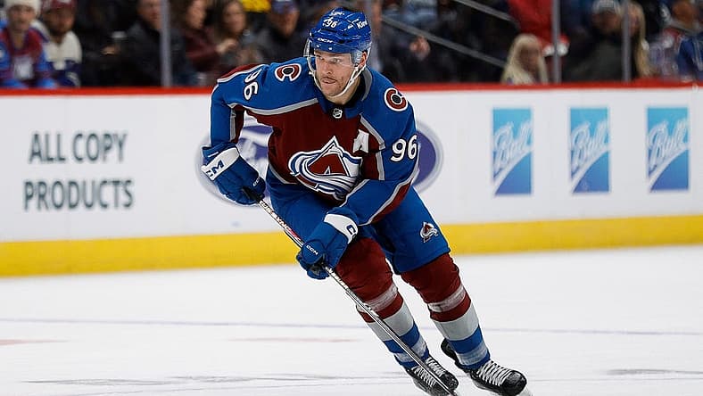 Dec 5, 2023; Denver, Colorado, USA; Colorado Avalanche right wing Mikko Rantanen (96) controls the puck in the second period against the Anaheim Ducks at Ball Arena. Mandatory Credit: Isaiah J. Downing-USA TODAY Sports