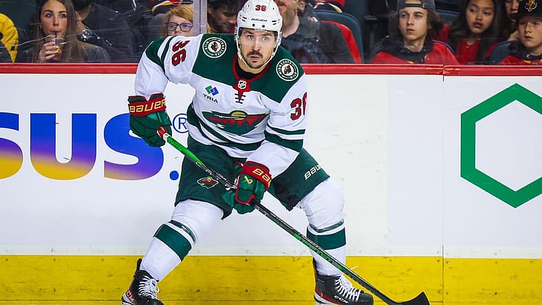 Dec 5, 2023; Calgary, Alberta, CAN; Minnesota Wild right wing Mats Zuccarello (36) controls the puck against the Calgary Flames during the first period at Scotiabank Saddledome. Mandatory Credit: Sergei Belski-USA TODAY Sports