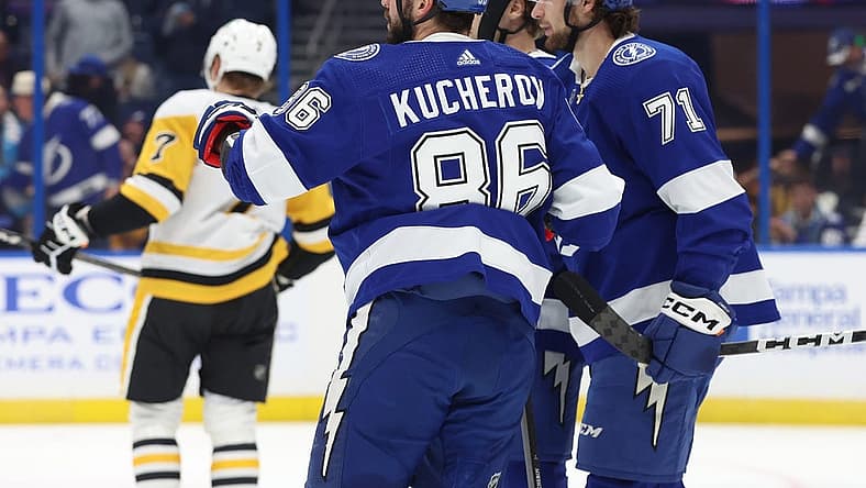 Dec 6, 2023; Tampa, Florida, USA; Tampa Bay Lightning center Anthony Cirelli (71) is congratulated by right wing Nikita Kucherov (86) and teammates after he scored a goal against the Pittsburgh Penguins during the first period at Amalie Arena. Mandatory Credit: Kim Klement Neitzel-USA TODAY Sports