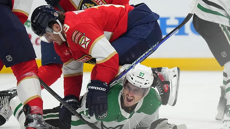 Dec 6, 2023; Sunrise, Florida, USA; Florida Panthers left wing Matthew Tkachuk (19) collides with Dallas Stars left wing Mason Marchment (27) during the first period at Amerant Bank Arena. Mandatory Credit: Jim Rassol-USA TODAY Sports