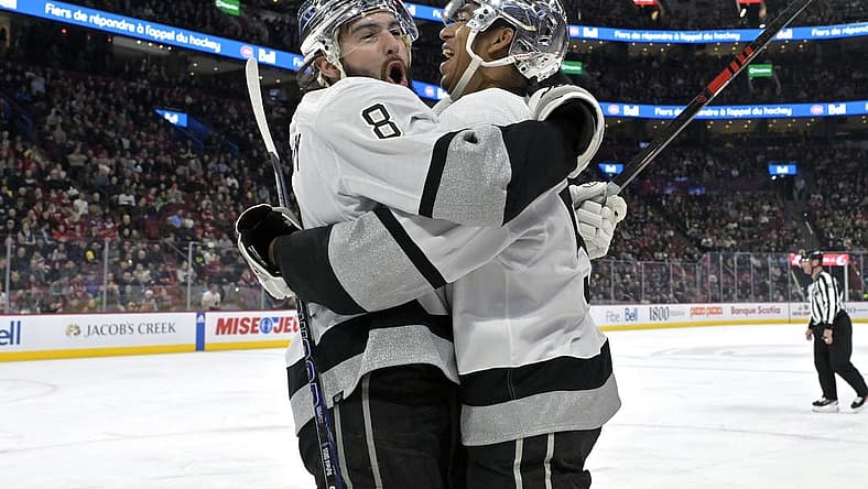 Dec 7, 2023; Montreal, Quebec, CAN; Los Angeles Kings defenseman Drew Doughty (8) celebrates with teammate forward Quinton Byfield (55) after scoring a goal against the Montreal Canadiens during the first period at the Bell Centre. Mandatory Credit: Eric Bolte-USA TODAY Sports