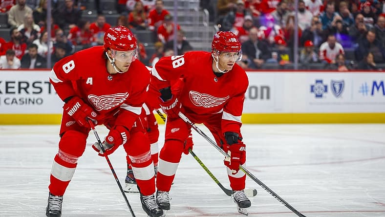 Dec 7, 2023; Detroit, Michigan, USA; Detroit Red Wings right wing Patrick Kane (88) and Detroit Red Wings defenseman Ben Chiarot (8) look on before a face off in the first period at Little Caesars Arena. Mandatory Credit: Brian Bradshaw Sevald-USA TODAY Sports