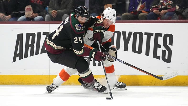 Dec 7, 2023; Tempe, Arizona, USA; Arizona Coyotes defenseman Matt Dumba (24) and Philadelphia Flyers left wing Joel Farabee (86) battle for the puck during the first period at Mullett Arena. Mandatory Credit: Joe Camporeale-USA TODAY Sports