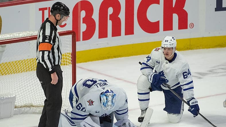 Dec 7, 2023; Ottawa, Ontario, CAN; Toronto Maple Leafs goalie Joseph Woll (60) is injured on a play in the third period against the Ottawa Senators at the Canadian Tire Centre. Mandatory Credit: Marc DesRosiers-USA TODAY Sports
