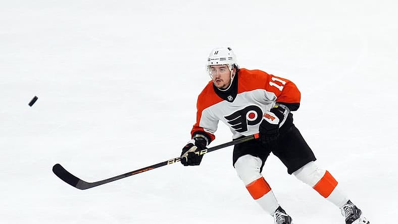 Dec 7, 2023; Tempe, Arizona, USA; Philadelphia Flyers right wing Travis Konecny (11) skates after a loose puck against the Arizona Coyotes during the third period at Mullett Arena. Mandatory Credit: Joe Camporeale-USA TODAY Sports