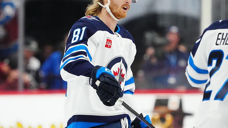Dec 7, 2023; Denver, Colorado, USA; Winnipeg Jets left wing Kyle Connor (81) celebrates his goal in the third period against the Colorado Avalanche at Ball Arena. Mandatory Credit: Ron Chenoy-USA TODAY Sports