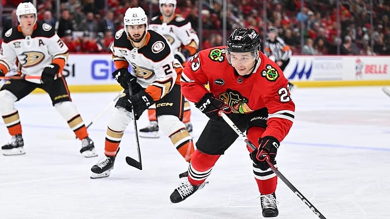 Dec 7, 2023; Chicago, Illinois, USA; Chicago Blackhawks forward Philipp Kurashev (23) skates the puck up the ice in the third period against the Anaheim Ducks at United Center. Mandatory Credit: Jamie Sabau-USA TODAY Sports