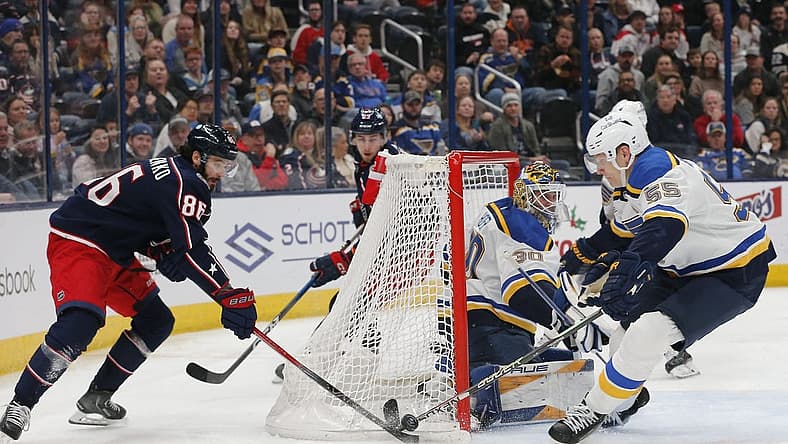 Dec 8, 2023; Columbus, Ohio, USA; St. Louis Blues defenseman Colton Parayko (55) stops the wraparound shot from Columbus Blue Jackets right wing Kirill Marchenko (86) during the second period at Nationwide Arena. Mandatory Credit: Russell LaBounty-USA TODAY Sports