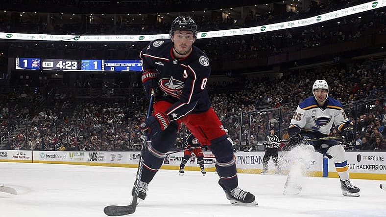 Dec 8, 2023; Columbus, Ohio, USA; Columbus Blue Jackets defenseman Zach Werenski (8) tracks down a loose puck against the St. Louis Blues during the first period at Nationwide Arena. Mandatory Credit: Russell LaBounty-USA TODAY Sports