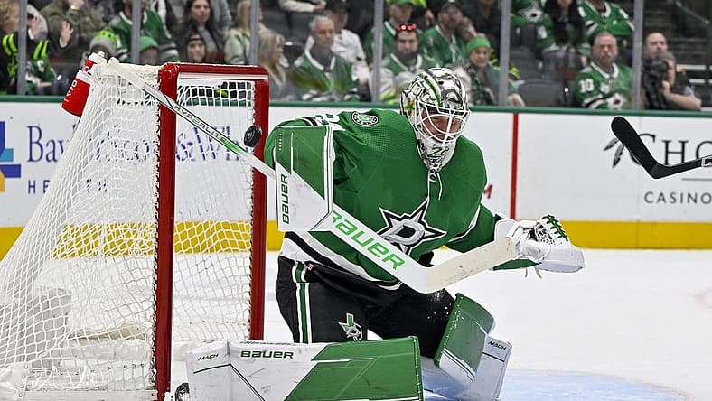 Dec 9, 2023; Dallas, Texas, USA; Dallas Stars goaltender Jake Oettinger (29) makes a stick save on a shot by the Vegas Golden Knights during the first period at the American Airlines Center. Mandatory Credit: Jerome Miron-USA TODAY Sports