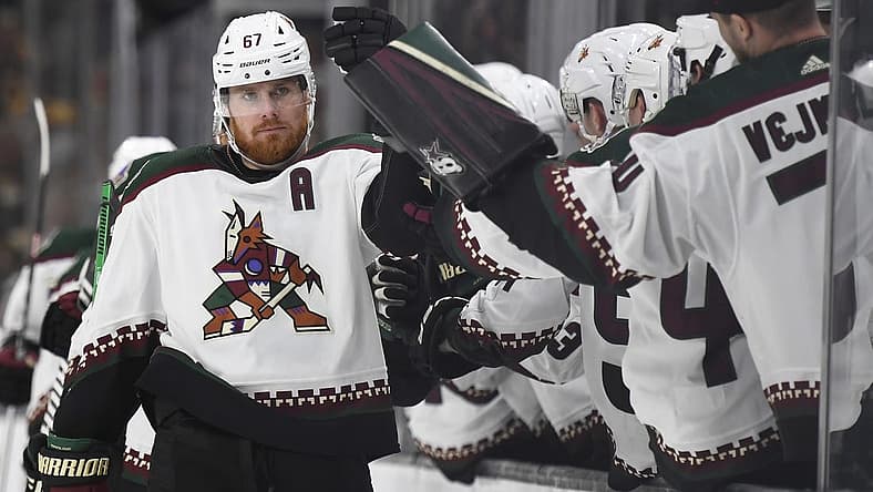 Dec 9, 2023; Boston, Massachusetts, USA; Arizona Coyotes left wing Lawson Crouse (67) celebrates with teammates after scoring a goal against the Boston Bruins during the third period at TD Garden. Mandatory Credit: Bob DeChiara-USA TODAY Sports