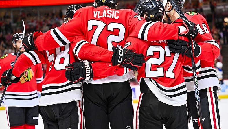 Dec 9, 2023; Chicago, Illinois, USA; Chicago Blackhawks defenseman Alex Vlasic (72) celebrates with teammates after scoring a goal in the first period against the St. Louis Blues at United Center. Mandatory Credit: Jamie Sabau-USA TODAY Sports