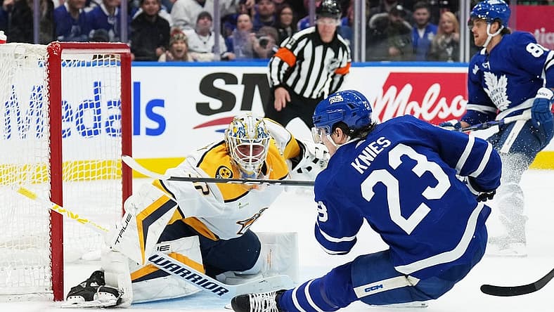 Dec 9, 2023; Toronto, Ontario, CAN; Toronto Maple Leafs left wing Matthew Knies (23) attempts a shot on Nashville Predators goaltender Kevin Lankinen (32) during the third period at Scotiabank Arena. Mandatory Credit: Nick Turchiaro-USA TODAY Sports