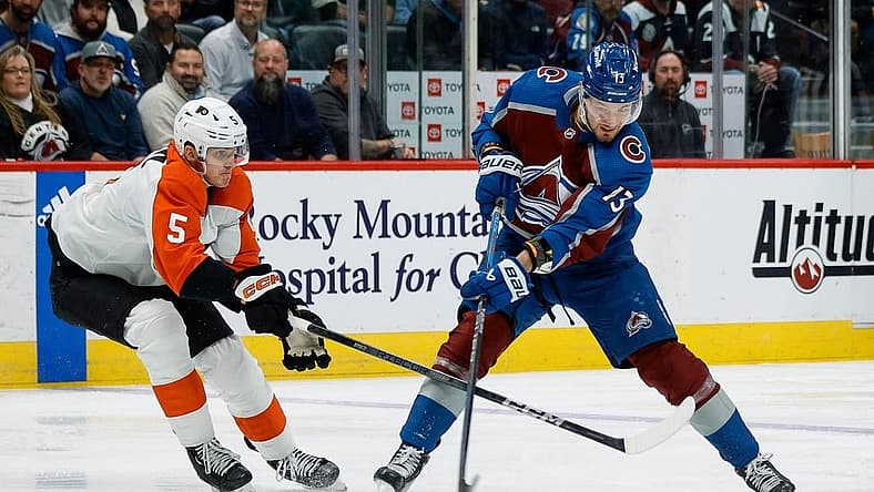 Dec 9, 2023; Denver, Colorado, USA; Colorado Avalanche right wing Valeri Nichushkin (13) shoots the puck as Philadelphia Flyers defenseman Egor Zamula (5) defends in the second period at Ball Arena. Mandatory Credit: Isaiah J. Downing-USA TODAY Sports