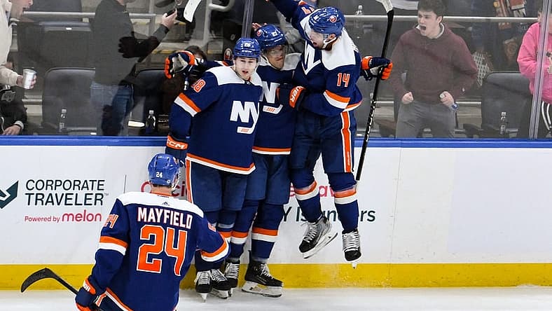 Dec 9, 2023; Elmont, New York, USA; New York Islanders left wing Anders Lee (27) celebrates with teammates after scoring a goal against the Los Angeles Kings during the third period at UBS Arena. Mandatory Credit: John Jones-USA TODAY Sports