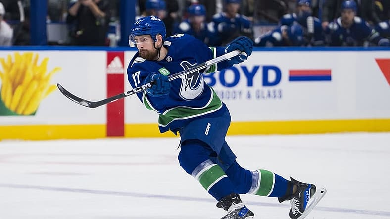 Dec 9, 2023; Vancouver, British Columbia, CAN; Vancouver Canucks defenseman Filip Hronek (17) shoots against the Carolina Hurricanes in the first period at Rogers Arena. Mandatory Credit: Bob Frid-USA TODAY Sports