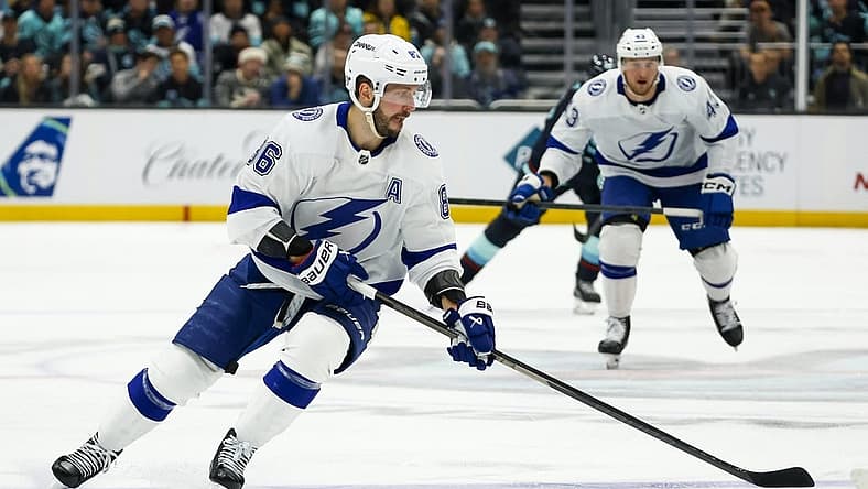 Dec 9, 2023; Seattle, Washington, USA; Tampa Bay Lightning right wing Nikita Kucherov (86) skates with the puck against the Seattle Kraken during the third period at Climate Pledge Arena. Mandatory Credit: Joe Nicholson-USA TODAY Sports