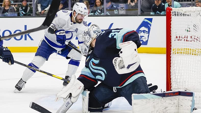 Dec 9, 2023; Seattle, Washington, USA; Tampa Bay Lightning right wing Nikita Kucherov (86) scores a goal against Seattle Kraken goaltender Philipp Grubauer (31) during the first period at Climate Pledge Arena. Mandatory Credit: Joe Nicholson-USA TODAY Sports