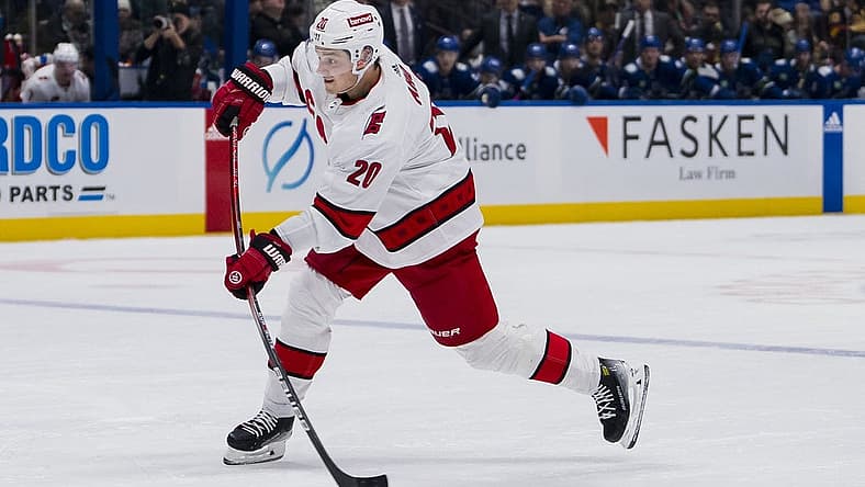 Dec 9, 2023; Vancouver, British Columbia, CAN; Carolina Hurricanes forward Sebastian Aho (20) shoots against the Vancouver Canucks in the second period at Rogers Arena. Mandatory Credit: Bob Frid-USA TODAY Sports