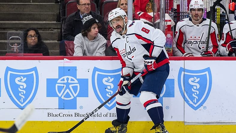Dec 10, 2023; Chicago, Illinois, USA; Washington Capitals left wing Alex Ovechkin (8) plays the puck against the Chicago Blackhawks during the first period at the United Center. Mandatory Credit: Daniel Bartel-USA TODAY Sports
