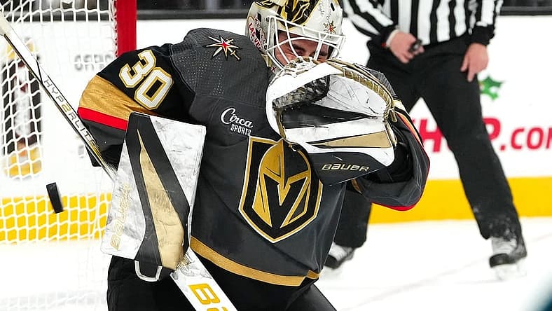 Dec 10, 2023; Las Vegas, Nevada, USA; Vegas Golden Knights goaltender Jiri Patera (30) makes a save against the San Jose Sharks during the first period at T-Mobile Arena. Mandatory Credit: Stephen R. Sylvanie-USA TODAY Sports