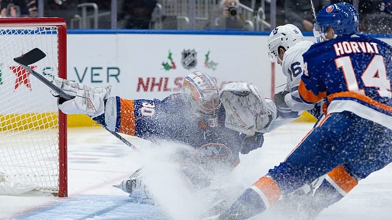 Dec 11, 2023; Elmont, New York, USA; New York Islanders goaltender Ilya Sorokin (30) makes a save after Toronto Maple Leafs right wing Mitchell Marner (16) takes a shot during the first period at UBS Arena. Mandatory Credit: Thomas Salus-USA TODAY Sports