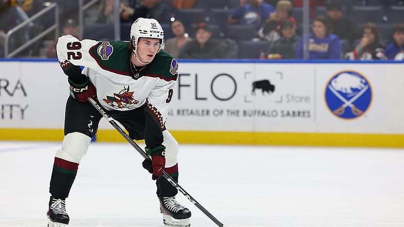 Dec 11, 2023; Buffalo, New York, USA; Arizona Coyotes center Logan Cooley (92) waits for the face-off during the third period against the Buffalo Sabres at KeyBank Center. Mandatory Credit: Timothy T. Ludwig-USA TODAY Sports