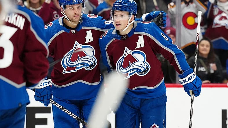 Dec 11, 2023; Denver, Colorado, USA; Colorado Avalanche defenseman Cale Makar (8) celebrates his goal with right wing Mikko Rantanen (96) in the second period against the Calgary Flames at Ball Arena. Mandatory Credit: Ron Chenoy-USA TODAY Sports