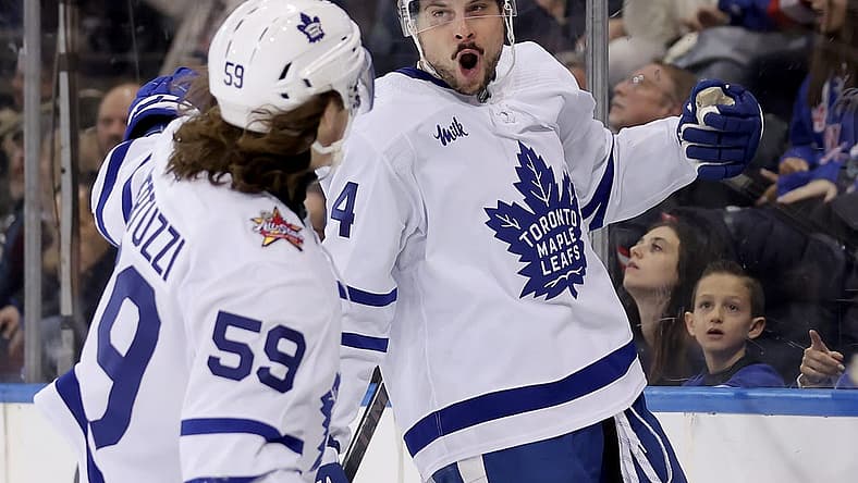Dec 12, 2023; New York, New York, USA; Toronto Maple Leafs center Auston Matthews (34) celebrates his goal against the New York Rangers with left wing Tyler Bertuzzi (59) during the third period at Madison Square Garden. Mandatory Credit: Brad Penner-USA TODAY Sports