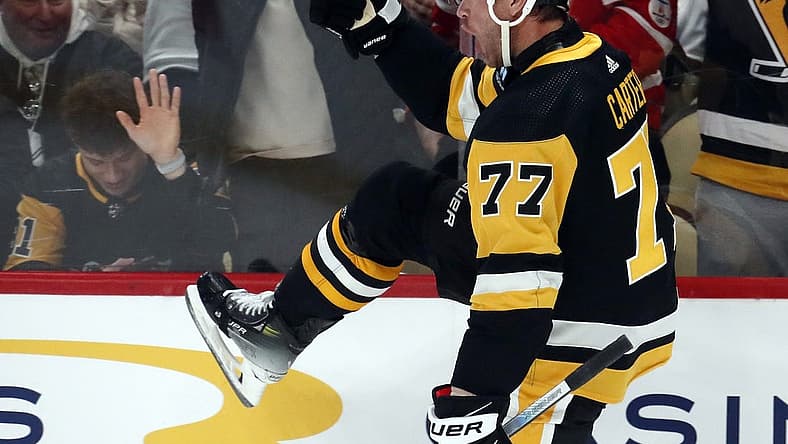 Dec 12, 2023; Pittsburgh, Pennsylvania, USA; Pittsburgh Penguins center Jeff Carter (77) reacts after scoring a short-handed goal against the Arizona Coyotes during the first period at PPG Paints Arena. Mandatory Credit: Charles LeClaire-USA TODAY Sports