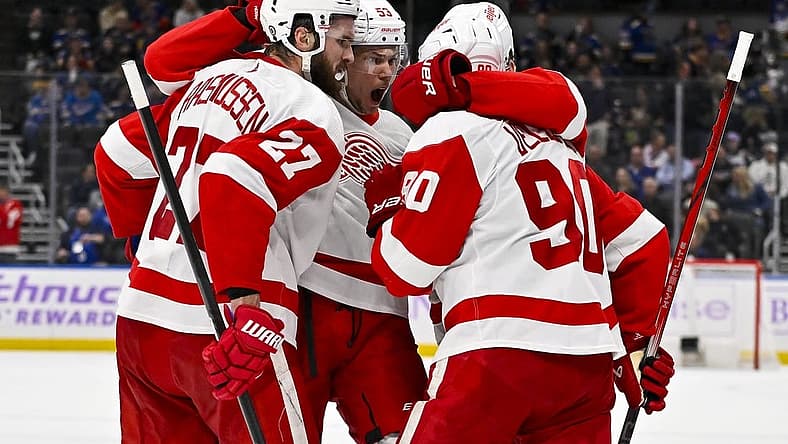 Dec 12, 2023; St. Louis, Missouri, USA; Detroit Red Wings center Michael Rasmussen (27) is congratulated by defenseman Moritz Seider (53) and center Joe Veleno (90) after scoring against the St. Louis Blues during the third period at Enterprise Center. Mandatory Credit: Jeff Curry-USA TODAY Sports