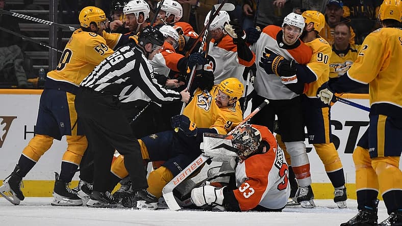 Dec 12, 2023; Nashville, Tennessee, USA; Nashville Predators and Philadelphia Flyers players have to be separated after a save by Philadelphia Flyers goaltender Samuel Ersson (33) during the second period at Bridgestone Arena. Mandatory Credit: Christopher Hanewinckel-USA TODAY Sports