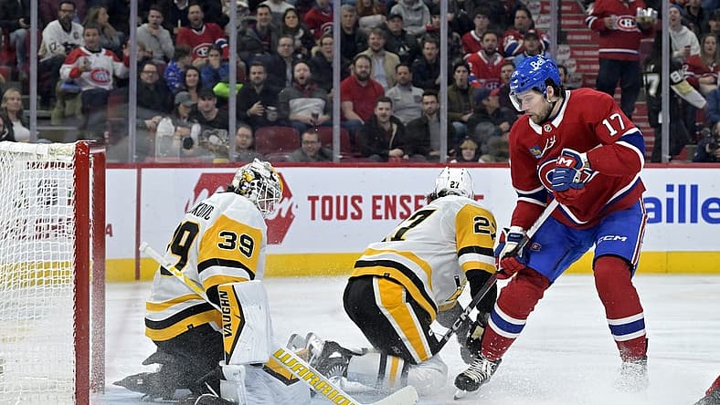 Dec 13, 2023; Montreal, Quebec, CAN; Pittsburgh Penguins Alex Nedeljkovic (39) stops Montreal Canadiens forward Josh Anderson (17) during the second period at the Bell Centre. Mandatory Credit: Eric Bolte-USA TODAY Sports