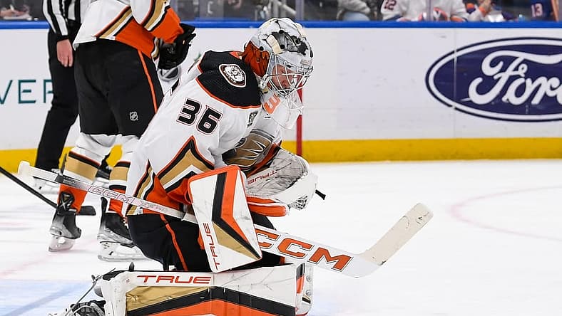 Dec 13, 2023; Elmont, New York, USA; Anaheim Ducks goaltender John Gibson (36) makes a save against the New York Islanders during the second period at UBS Arena. Mandatory Credit: Dennis Schneidler-USA TODAY Sports