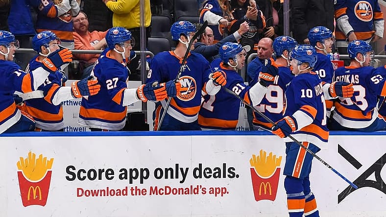 Dec 13, 2023; Elmont, New York, USA; New York Islanders right wing Simon Holmstrom (10) celebrates his short handed game winning goal against the Anaheim Ducks with the New York Islanders bench during the third period at UBS Arena. Mandatory Credit: Dennis Schneidler-USA TODAY Sports