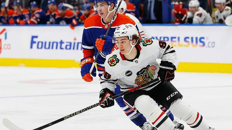 Dec 12, 2023; Edmonton, Alberta, CAN; Chicago Blackhawks forward Connor Bedard (98) looks for a loose puck against the Edmonton Oilers at Rogers Place. Mandatory Credit: Perry Nelson-USA TODAY Sports