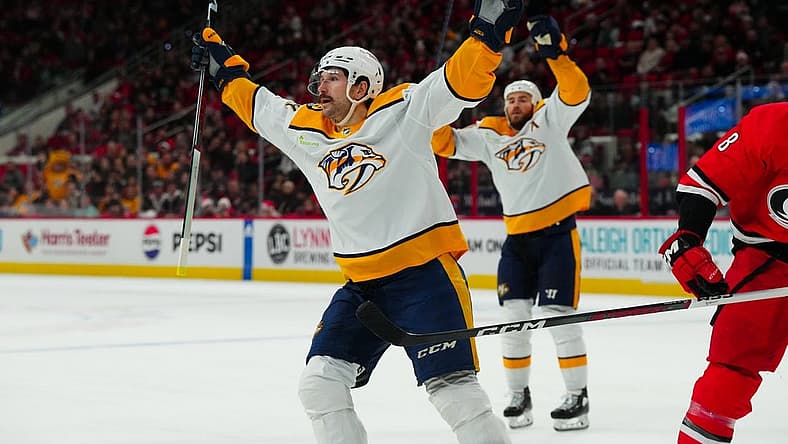 Dec 15, 2023; Raleigh, North Carolina, USA; Nashville Predators left wing Filip Forsberg (9) celebrates his game winning goal in the overtime against the Carolina Hurricanes at PNC Arena. Mandatory Credit: James Guillory-USA TODAY Sports
