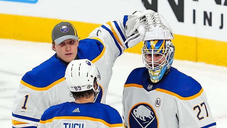 Dec 15, 2023; Las Vegas, Nevada, USA; Buffalo Sabres goaltender Devon Levi (27) celebrates with Buffalo Sabres goaltender Ukko-Pekka Luukkonen (1) and Buffalo Sabres right wing Alex Tuch (89) after the Sabres defeated the Vegas Golden Knights 5-2 at T-Mobile Arena. Mandatory Credit: Stephen R. Sylvanie-USA TODAY Sports