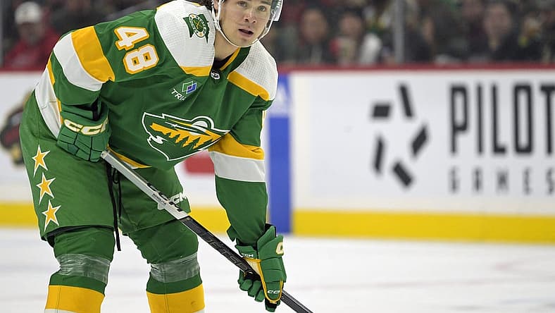 Dec 16, 2023; Saint Paul, Minnesota, USA; Minnesota Wild defenseman Daemon Hunt (48) gets into position against the Vancouver Canucks during the first period at Xcel Energy Center. Mandatory Credit: Nick Wosika-USA TODAY Sports