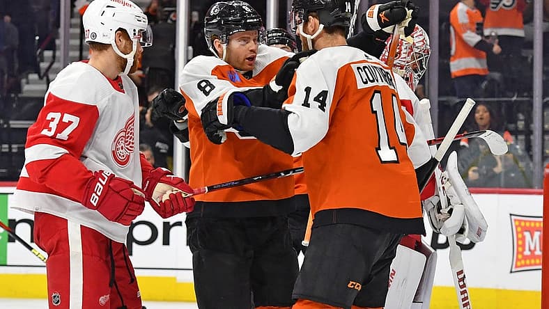 Dec 16, 2023; Philadelphia, Pennsylvania, USA; Philadelphia Flyers defenseman Cam York (8) celebrates his goal with center Sean Couturier (14) against the Detroit Red Wings during the first period at Wells Fargo Center. Mandatory Credit: Eric Hartline-USA TODAY Sports