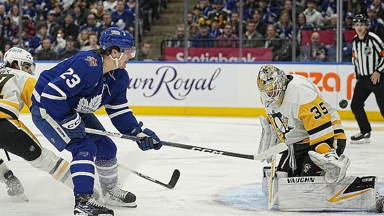 Dec 16, 2023; Toronto, Ontario, CAN; Toronto Maple Leafs forward Matthew Knies (23) scores against Pittsburgh Penguins goaltender Tristan Jarry (35) during the first period at Scotiabank Arena. Mandatory Credit: John E. Sokolowski-USA TODAY Sports