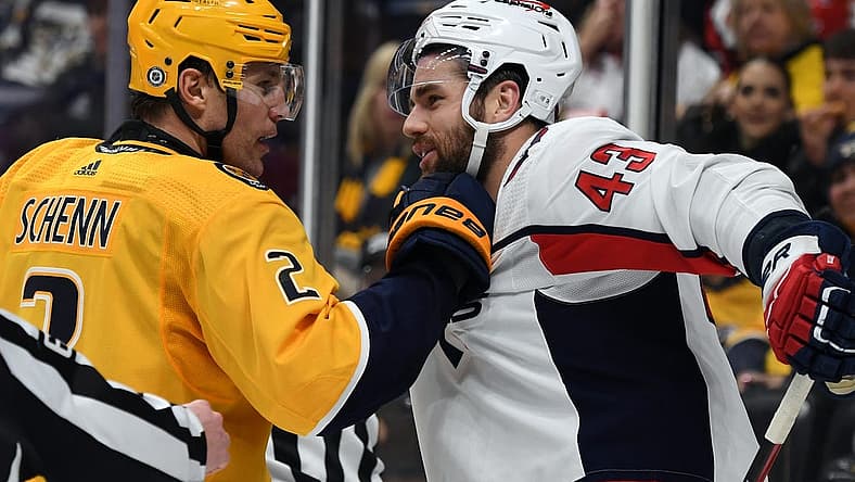 Dec 16, 2023; Nashville, Tennessee, USA; Nashville Predators defenseman Luke Schenn (2) grabs the jersey of Washington Capitals right wing Tom Wilson (43) after a play during the second period at Bridgestone Arena. Mandatory Credit: Christopher Hanewinckel-USA TODAY Sports