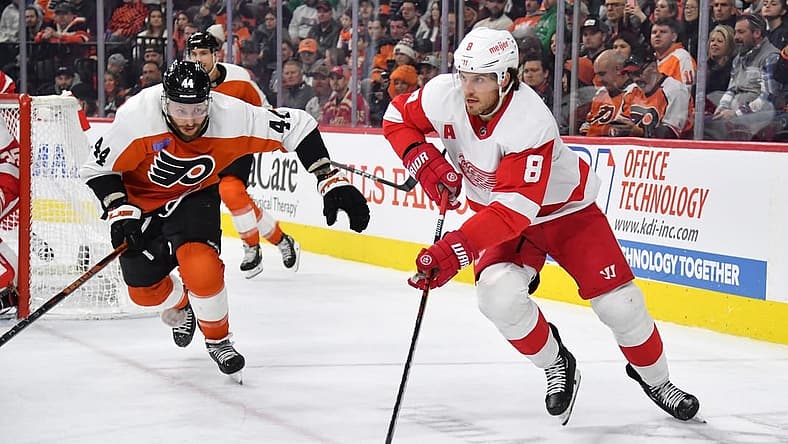 Dec 16, 2023; Philadelphia, Pennsylvania, USA; Detroit Red Wings defenseman Ben Chiarot (8) skates with the puck against Philadelphia Flyers left wing Nicolas Deslauriers (44) during the third period at Wells Fargo Center. Mandatory Credit: Eric Hartline-USA TODAY Sports