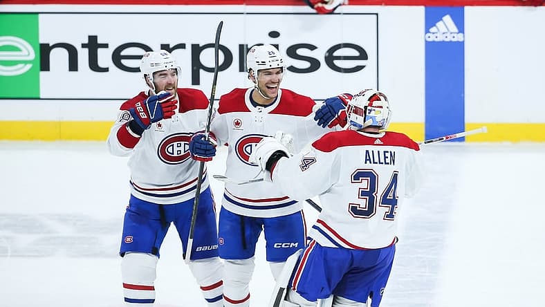 Dec 18, 2023; Winnipeg, Manitoba, CAN;  Montreal Canadiens goalie Jake Allen (34) is congratulated by his team mates on his win against the Winnipeg Jets at the end of the overtime period at Canada Life Centre. Mandatory Credit: Terrence Lee-USA TODAY Sports