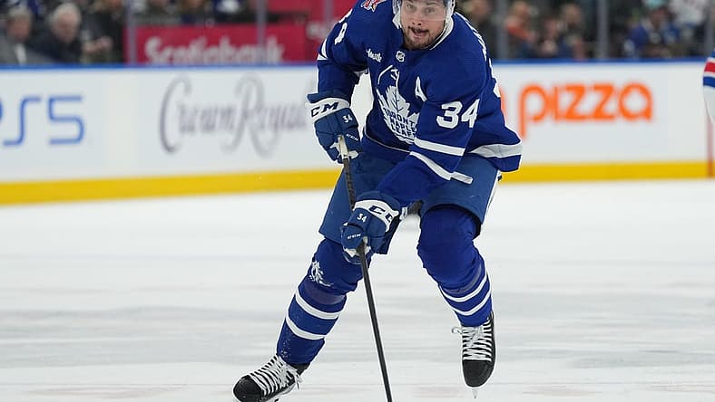 Dec 19, 2023; Toronto, Ontario, CAN; Toronto Maple Leafs center Auston Matthews (34) skates with the puck against the New York Rangers during the first period at Scotiabank Arena. Mandatory Credit: Nick Turchiaro-USA TODAY Sports