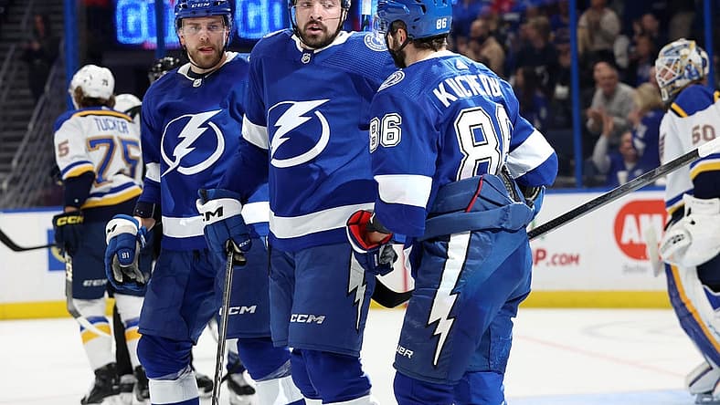 Dec 19, 2023; Tampa, Florida, USA; Tampa Bay Lightning right wing Nikita Kucherov (86) is congratulated after he scored during the first period against the St. Louis Blues at Amalie Arena. Mandatory Credit: Kim Klement Neitzel-USA TODAY Sports